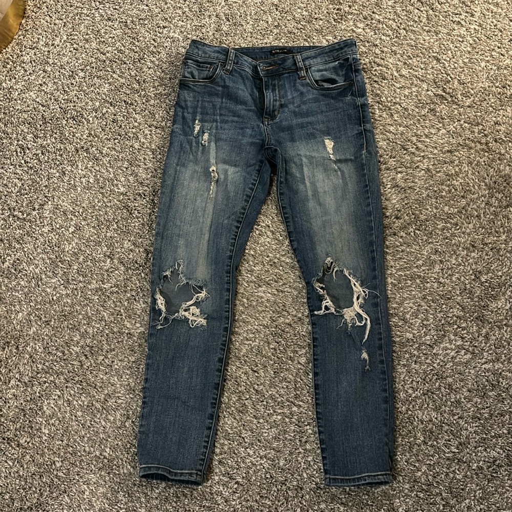 Distressed blue jeans
